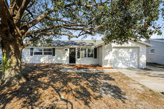 ranch-style home featuring a garage