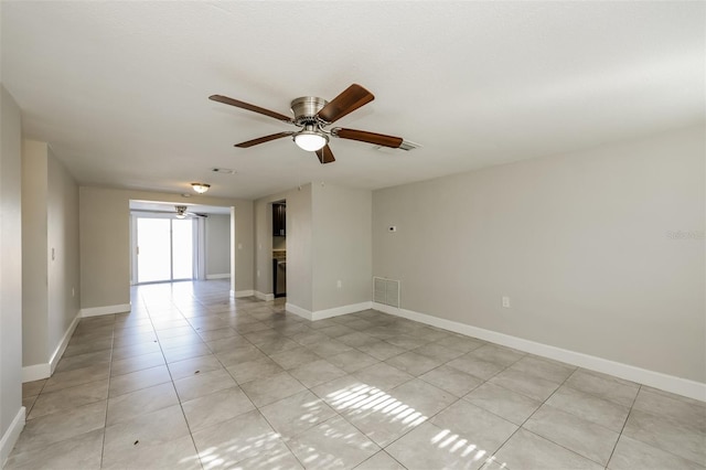 unfurnished room with ceiling fan and light tile patterned floors