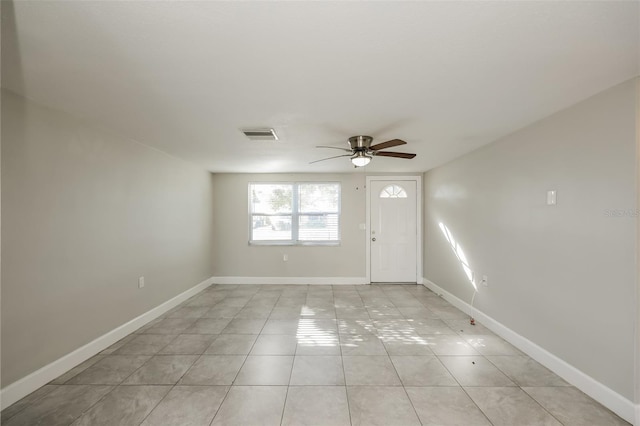 tiled entryway with ceiling fan