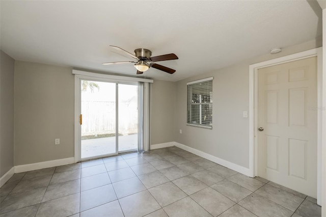 tiled empty room with ceiling fan