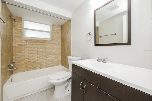 full bathroom with tile patterned flooring, vanity, toilet, and tiled shower / bath