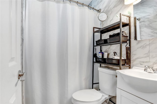 bathroom featuring backsplash, vanity, tile walls, toilet, and curtained shower