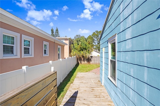 view of home's exterior featuring a wooden deck