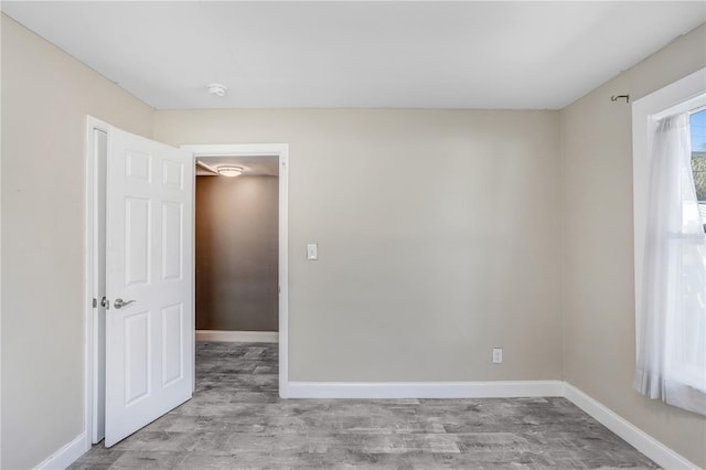 spare room featuring light hardwood / wood-style floors