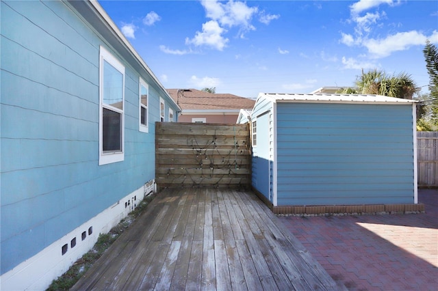 wooden deck featuring a shed