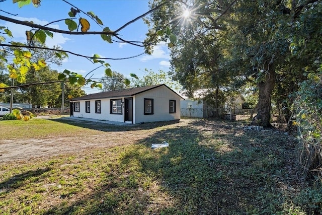 view of home's exterior with a lawn