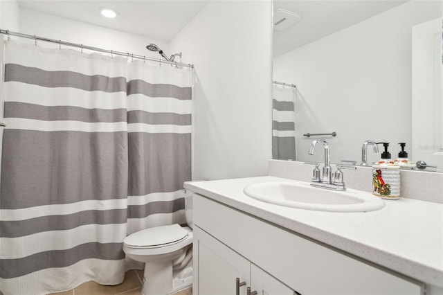 bathroom featuring tile patterned floors, a shower with curtain, vanity, and toilet