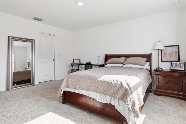 bedroom featuring light colored carpet