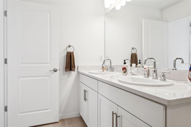 bathroom with tile patterned flooring and vanity