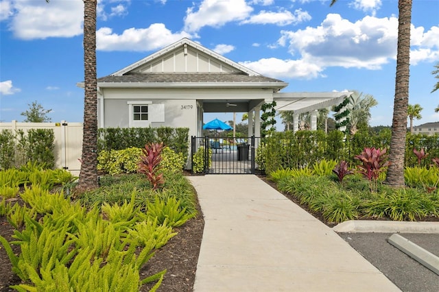 view of property's community with a gate and fence