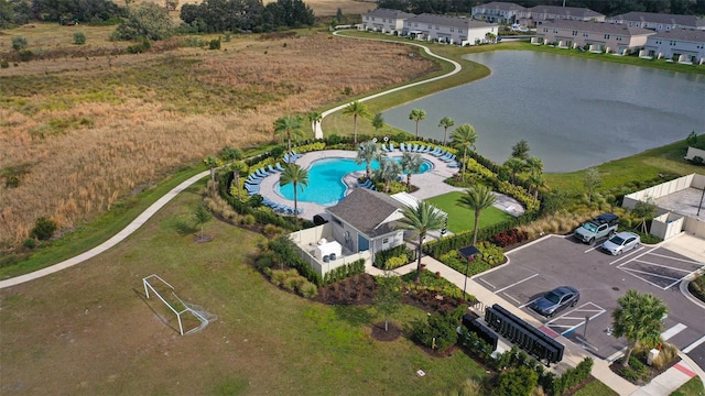 drone / aerial view featuring a residential view and a water view