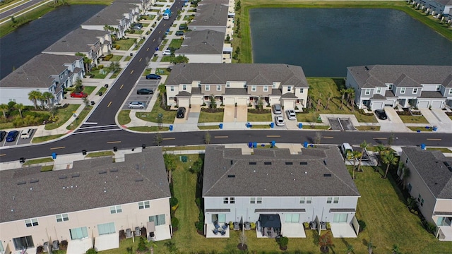 aerial view with a residential view and a water view