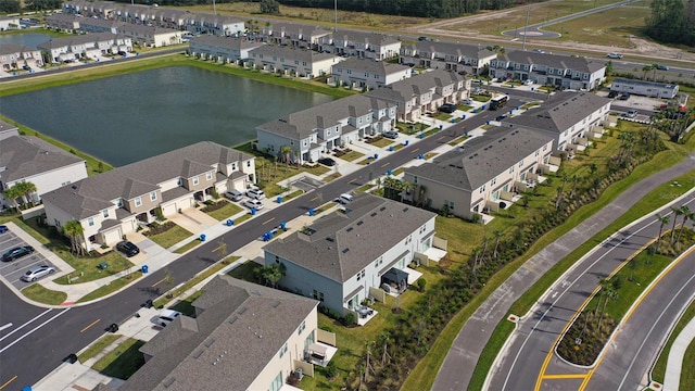 bird's eye view with a residential view and a water view