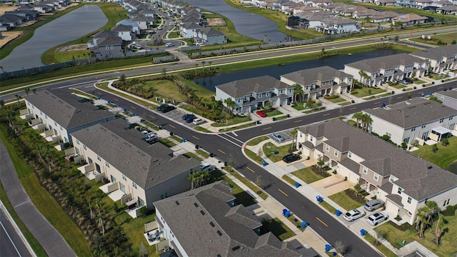 aerial view featuring a residential view and a water view