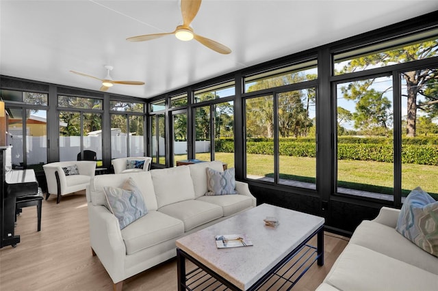 sunroom / solarium with ceiling fan