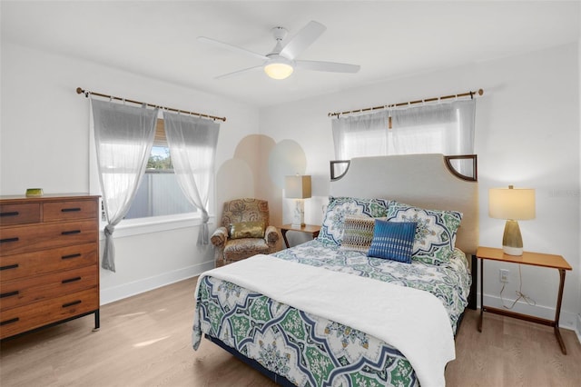 bedroom featuring ceiling fan and light hardwood / wood-style flooring