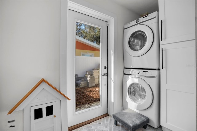 laundry room with stacked washer and clothes dryer