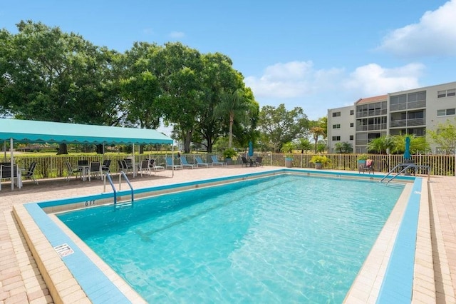 view of swimming pool featuring a patio