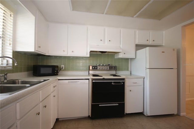 kitchen with decorative backsplash, white appliances, sink, light tile patterned floors, and white cabinetry