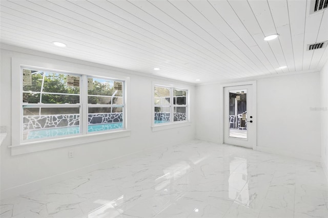 empty room with crown molding and wood ceiling