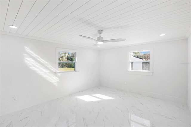 unfurnished room with ceiling fan, wooden ceiling, and crown molding