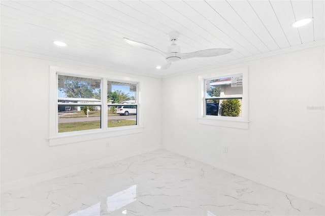 spare room with ceiling fan, crown molding, and wooden ceiling