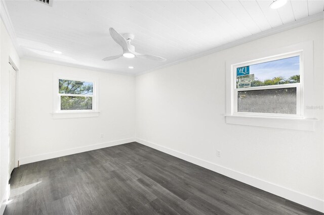 unfurnished room featuring ceiling fan, dark hardwood / wood-style floors, and ornamental molding