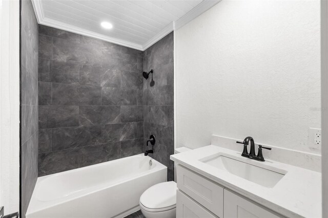 full bathroom featuring vanity, toilet, tiled shower / bath, and crown molding