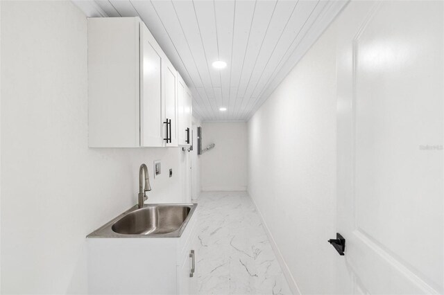 kitchen with sink and white cabinets