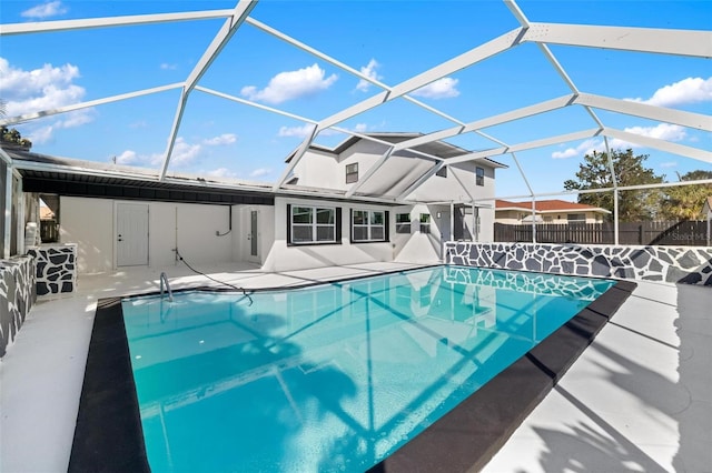 view of pool featuring a lanai and a patio