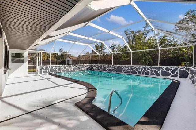 view of pool featuring a patio and a lanai