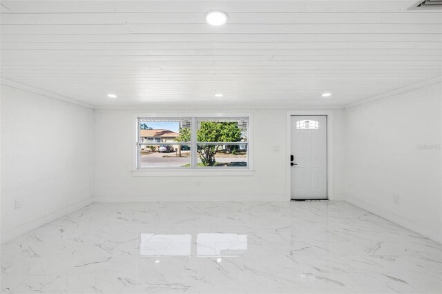 foyer entrance featuring wooden ceiling and ornamental molding