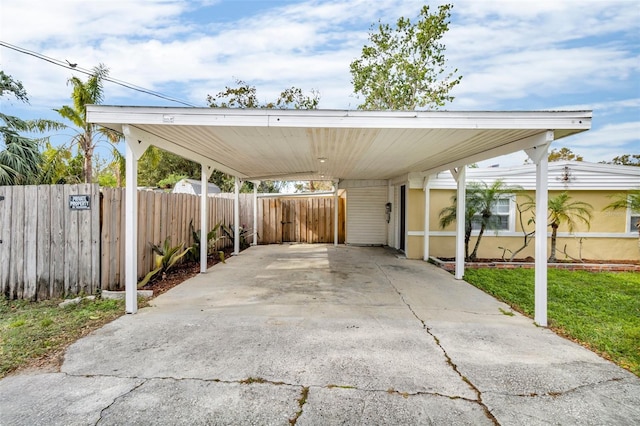 view of vehicle parking featuring a carport