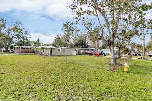 view of yard with a carport