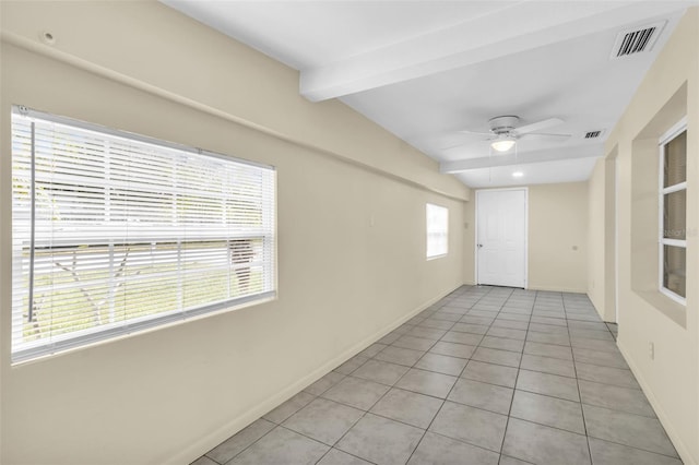 unfurnished room featuring ceiling fan, light tile patterned floors, and lofted ceiling with beams