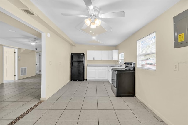 kitchen featuring white cabinetry, sink, ceiling fan, light tile patterned floors, and black appliances