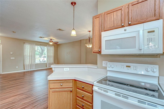 kitchen with white appliances, ceiling fan, light brown cabinetry, decorative light fixtures, and light hardwood / wood-style floors