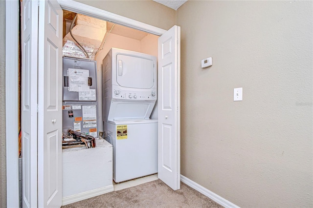 washroom featuring carpet floors and stacked washer and dryer