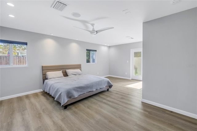 bedroom featuring ceiling fan and light hardwood / wood-style floors