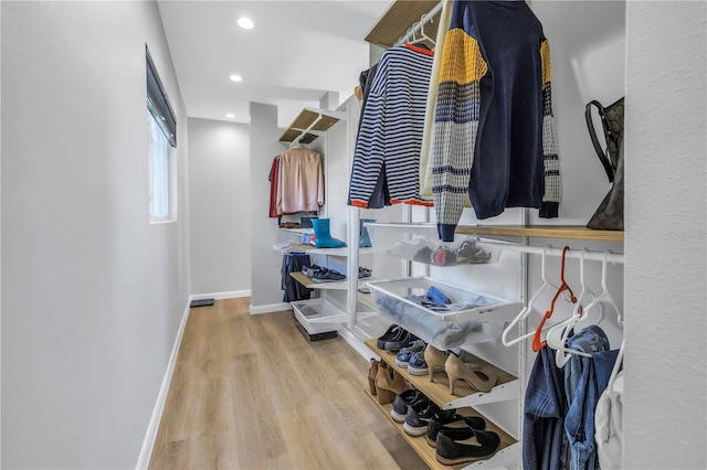 spacious closet featuring light hardwood / wood-style flooring