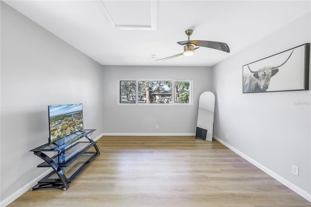 living area featuring ceiling fan and light wood-type flooring