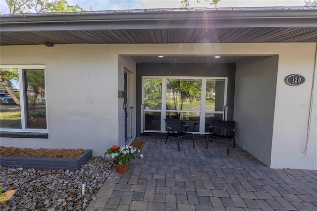 entrance to property with a patio