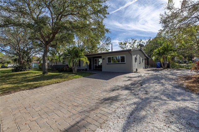 ranch-style house with a front yard