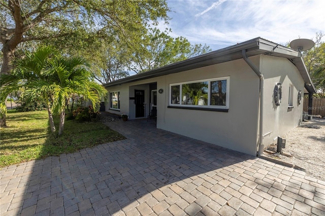 single story home featuring a patio area