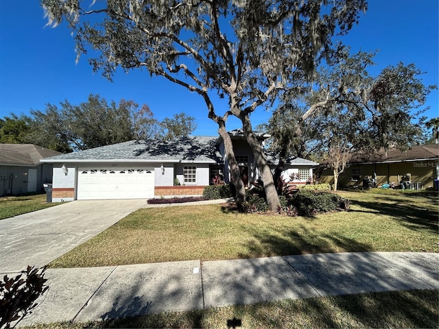 ranch-style house featuring a garage and a front lawn