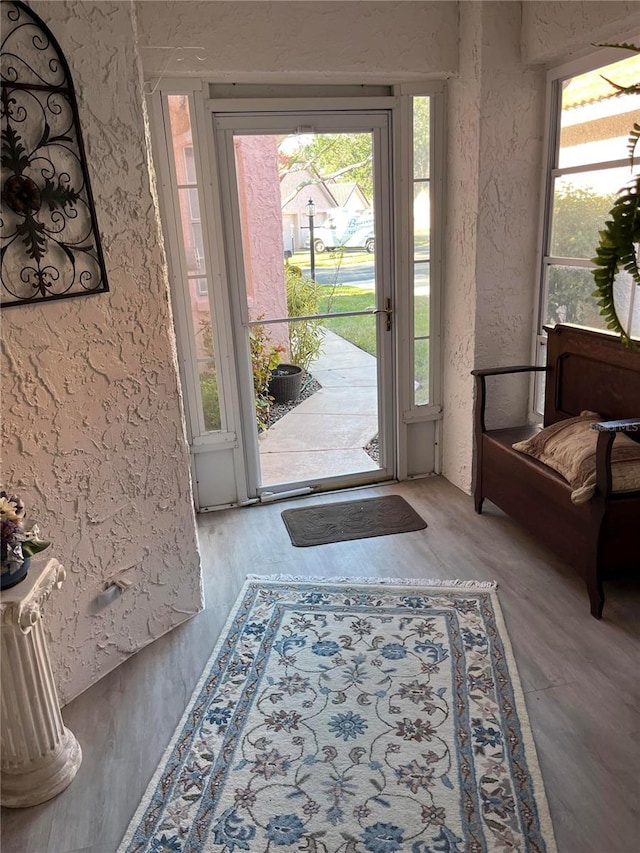 entryway with light hardwood / wood-style flooring