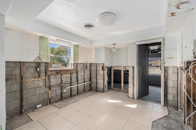 bathroom with tile patterned floors