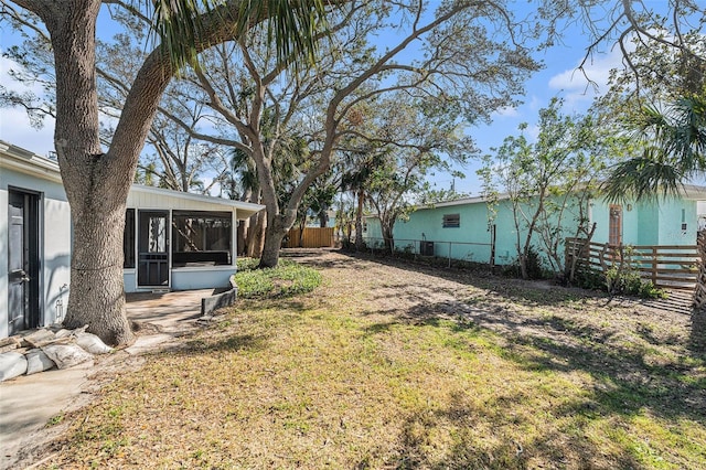 view of yard with a sunroom