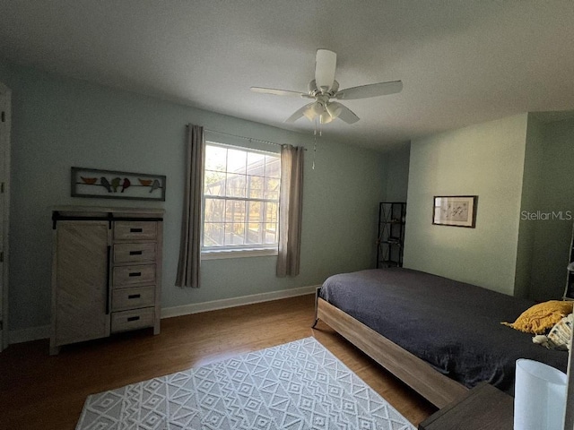 bedroom featuring wood-type flooring and ceiling fan