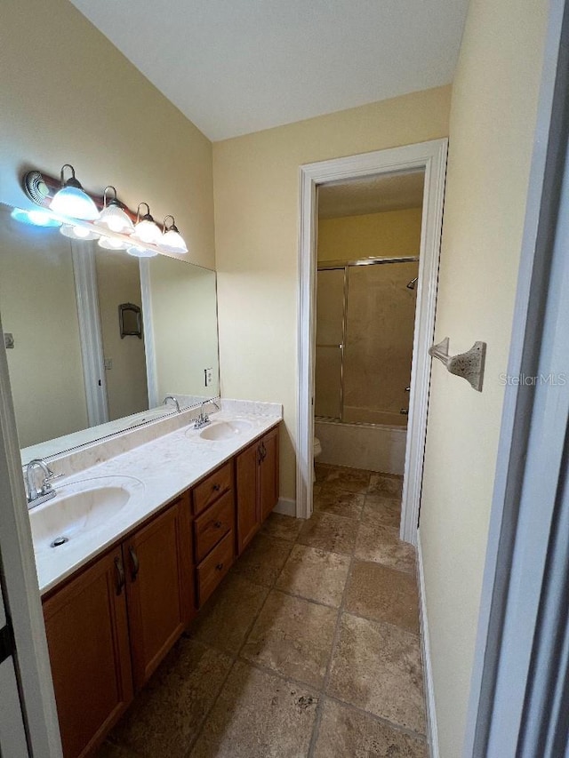 full bathroom with washtub / shower combination, vanity, and toilet